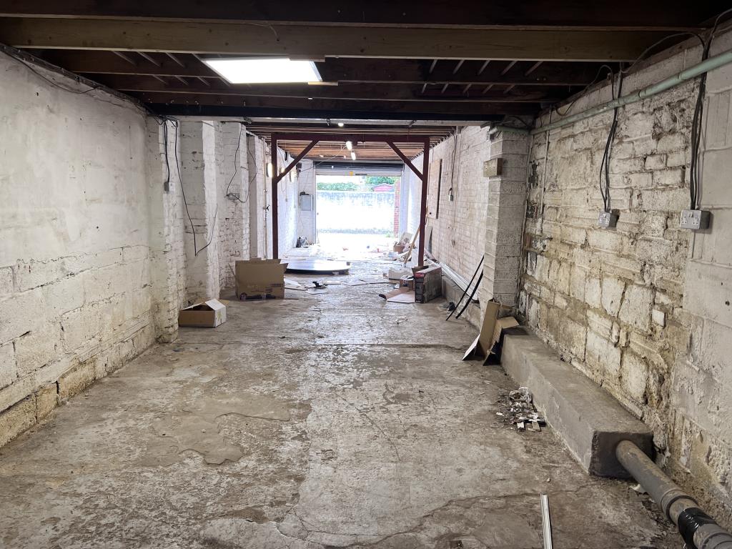 Lot: 180 - FREEHOLD GARAGE WORKSHOP - Inside view looking towards the entrance